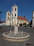 Fountain with Star and Saint Bartholomew church. Listed ID 5672. - Gyöngyös, Hungary.JPG